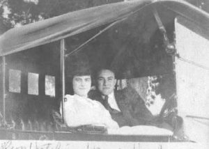 1930-1939 Couple (Madelyn Hutchins & James Harkness) sitting in an automobile