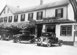 1930-1939 Hotel Calvert with three automobiles in front, Prince Frederick, Md