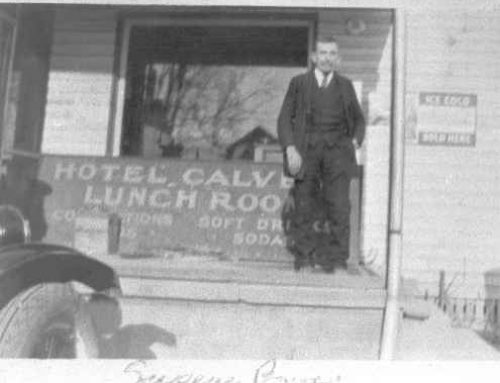 1930-1939 Man (Eugene Bowen) in front of Hotel Calvert Lunch room